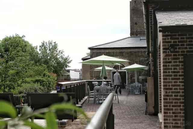 Outdoor cafe terrace with flexible seating, ideal for networking and breakout events.