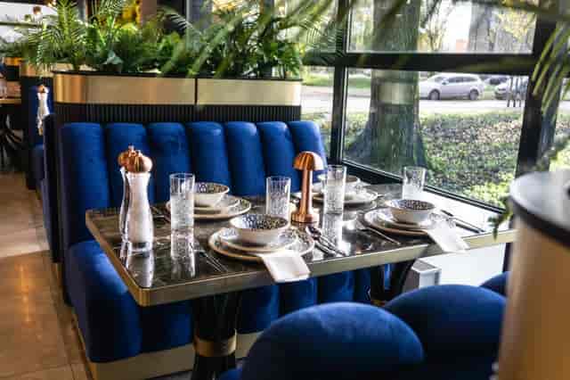 Tava London dining area with blue velvet banquettes for VIP client lunches and business meetings.