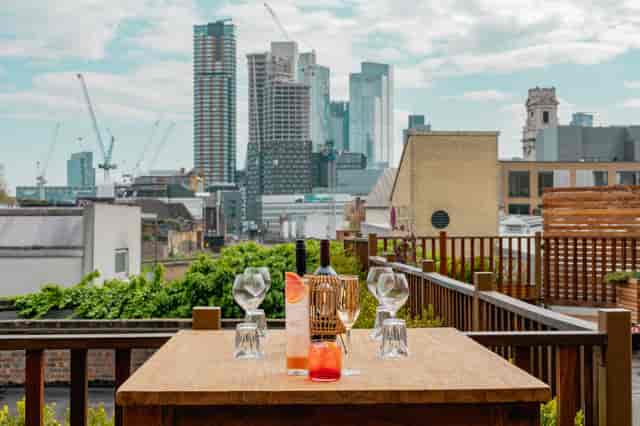 The Orangery at TT Liquor: rooftop venue with skyline view for corporate cocktail receptions.