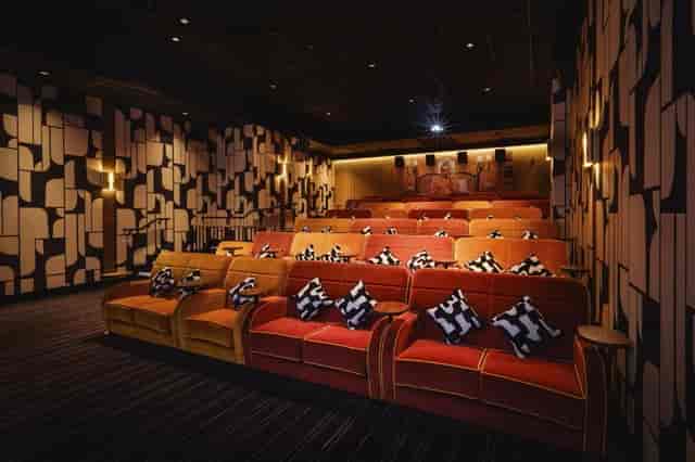 Luxury VIP screening room with plush seating for exclusive film previews and brand events.