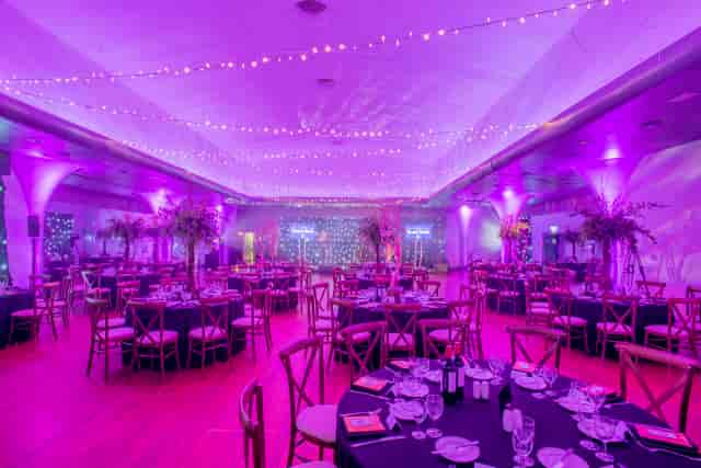 Diamond Suite ballroom gala dinner setup with elegant mood lighting for corporate events.