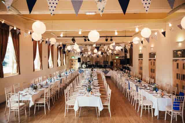 Garforth Suite banquet setup with festive lanterns for weddings and corporate events.