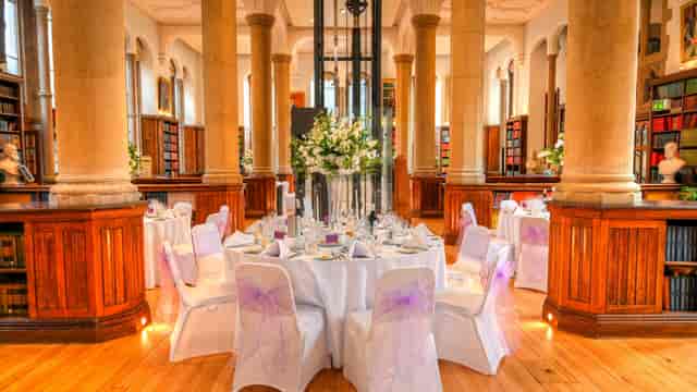 Garforth Suite banquet hall with historic wood paneling for formal events and gala celebrations.