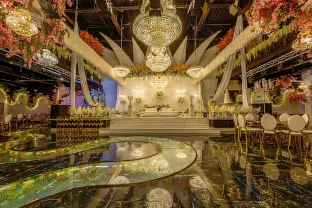 Golden Lobby stage setup with floral decor for luxury corporate events and gala venue hire.