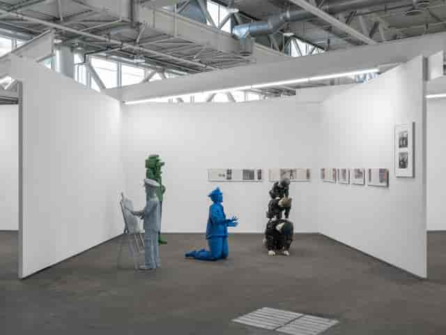 Blue Bird sculptural exhibit at W London trade show booth, minimalist gallery installation.