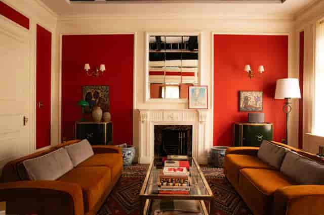 Red VIP breakout lounge at W London for private meetings and professional consultations.
