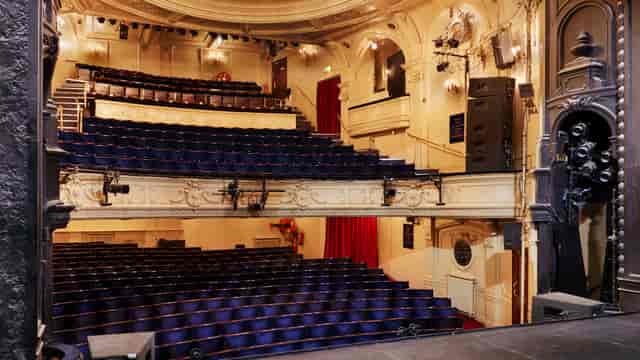 Ambassadors Theatre tiered auditorium for keynote presentations and award ceremonies.