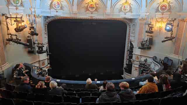 Ambassadors Theatre interior: tiered seating and stage lighting for corporate events and awards.