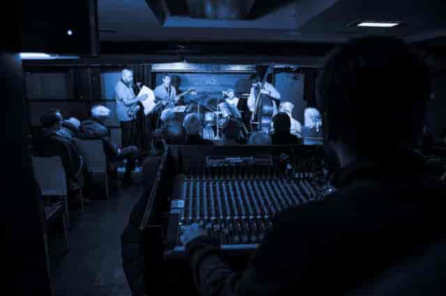 Studio 101 jazz venue with FOH engineer, acoustic live performance, event production.