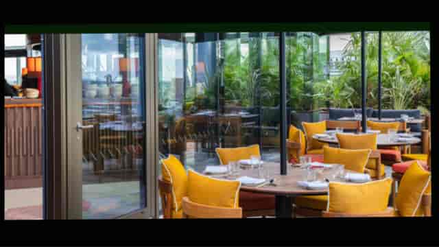 Taqueria at Itzel Club: Outdoor corporate luncheon and networking event venue with lush seating.