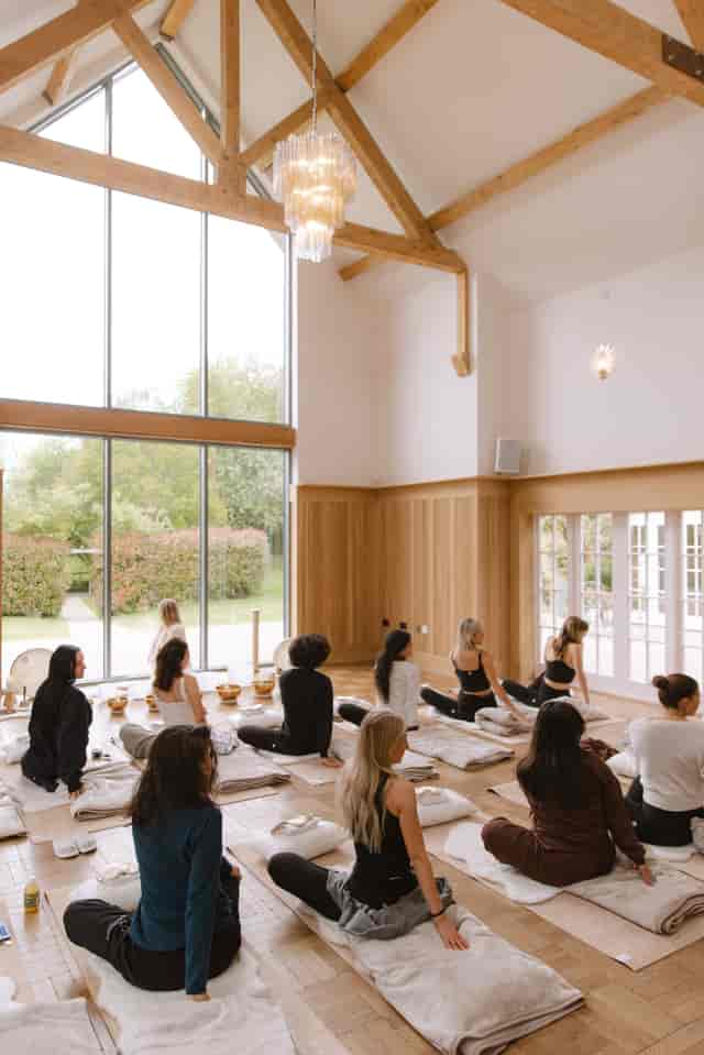 Millbridge Court Gallery event space with floor-to-ceiling windows for corporate wellness retreats.