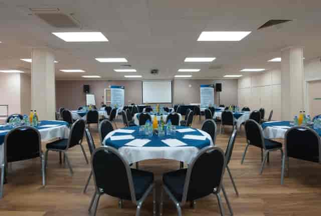 Kings Hall College banquet-style seminar room for professional conference breakout sessions.