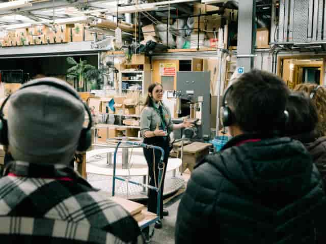 Backstage tour at Tensor Studios using wireless headsets for immersive event production.