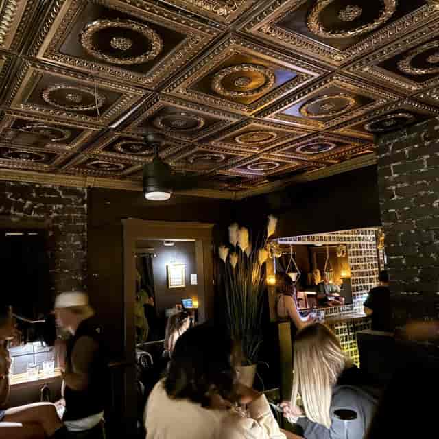 Tensor Studios bar lounge with industrial decor for exclusive networking and private events.