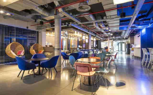 Industrial-chic lounge and bar at Tensor Studios, ideal for networking and corporate events.