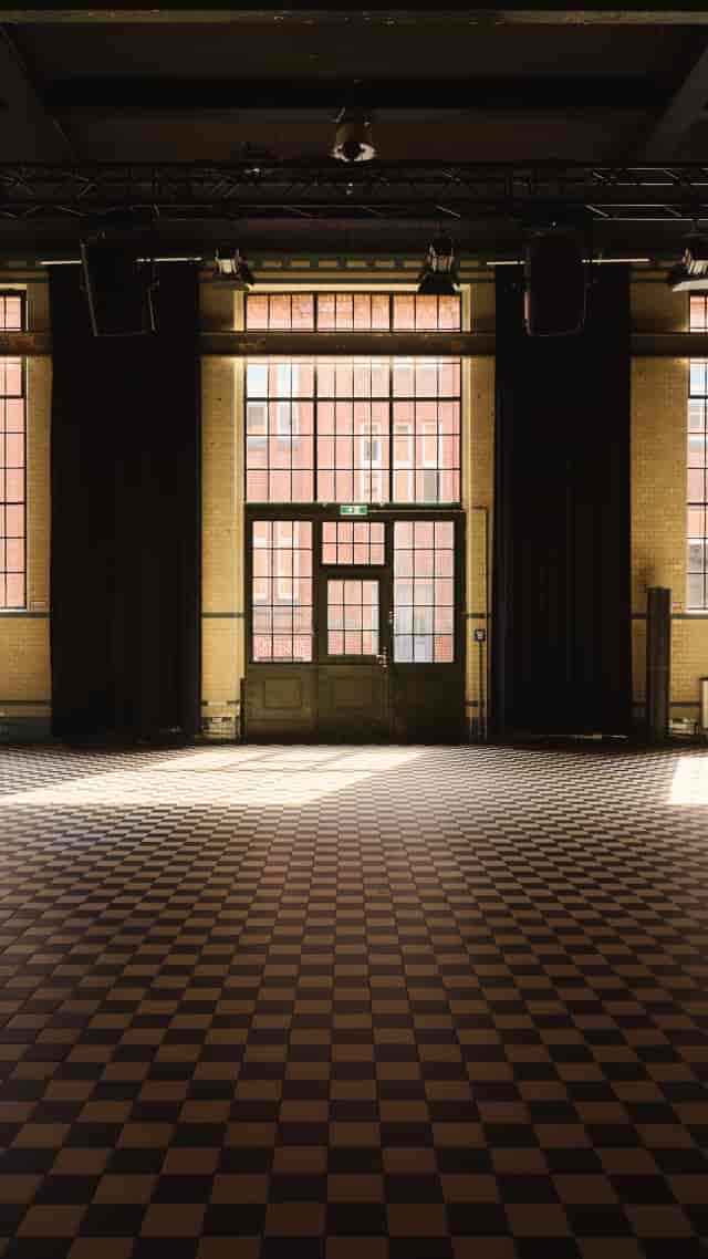 Industrial-chic Room Alpha venue with high ceilings for event space rental and photography studio.