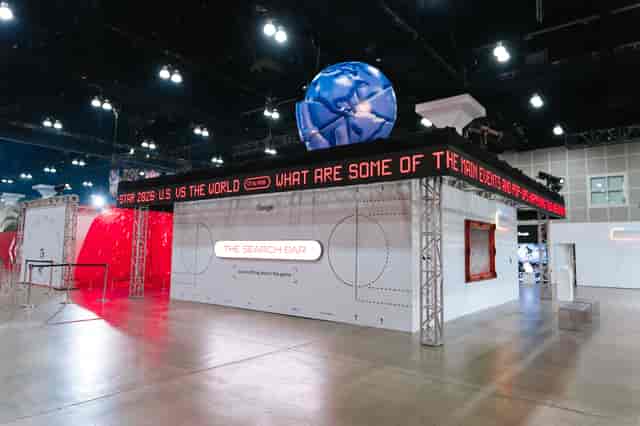 Tradeshow booth in Room Beta with LED ticker for brand engagement and experiential marketing.