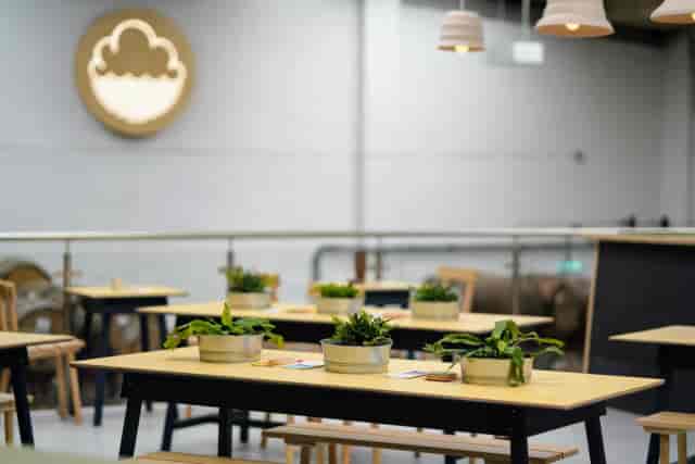 Industrial-chic Cloudwater Brewery venue with modular tables for workshops and networking events.
