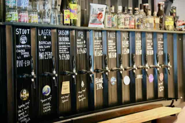 Craft beer tap wall at Cloudwater Brewery for networking events and social hours.