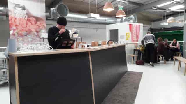 Industrial pop-up café and networking lounge at Cloudwater Brewery event venue.