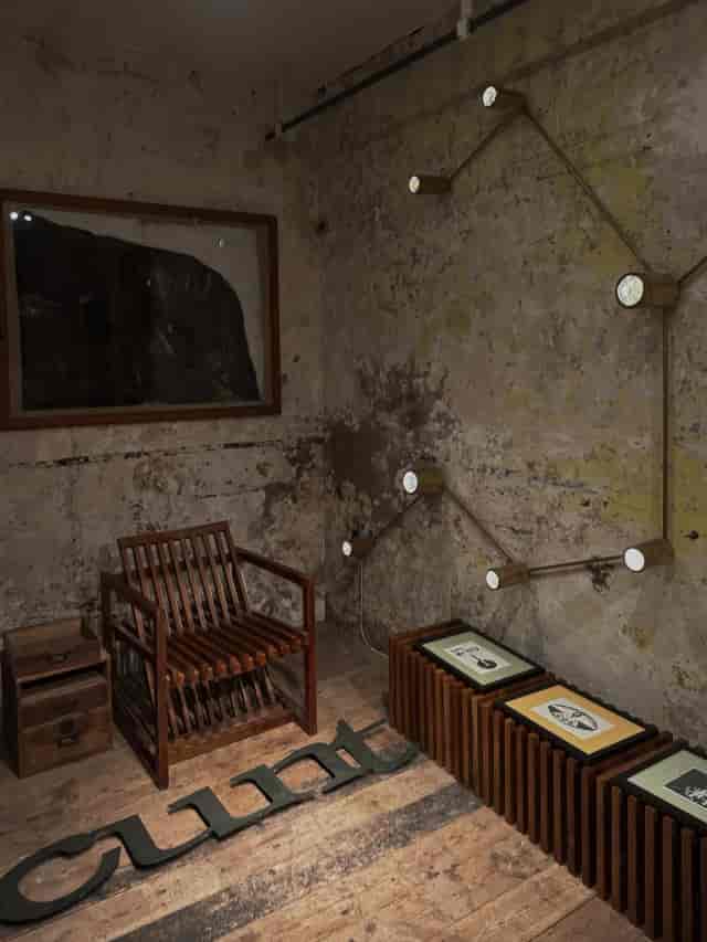 Industrial-chic private event space with distressed textures for VIP networking and consultations.