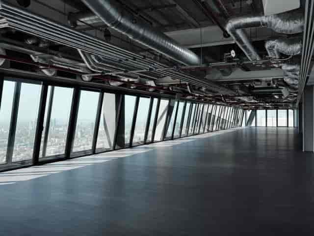 White box venue in London with industrial ceiling for corporate launches and evening receptions.