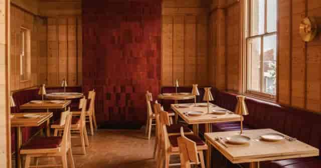 The Dining Room at The White Horse: Sophisticated wood interior for executive retreat board dinners.