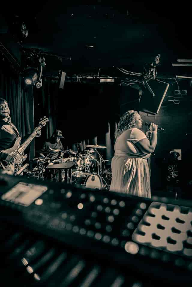 Live musical act on stage at DJ Room, Kiss Camden, featuring professional lighting and AV setup.