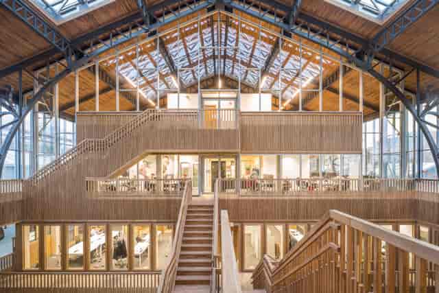 Industrial Gare Maritime venue with tiered mezzanine for product launches and creative workshops.