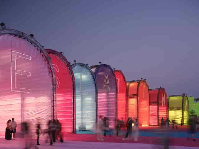 Illuminated modular archway at Gare Maritime experiential festival event entrance.