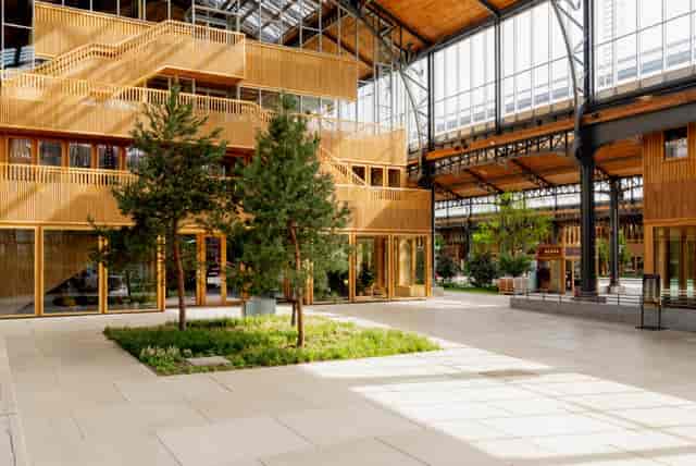 Gare Maritime food market with industrial-chic biophilic design for event venue or product launch.