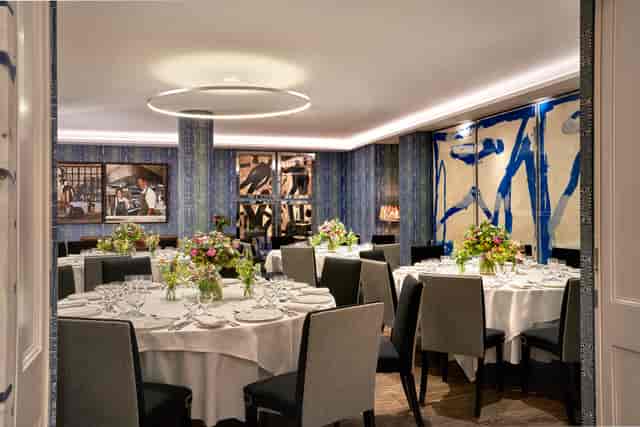 Private dining room with contemporary art for executive board dinners and boutique social events.