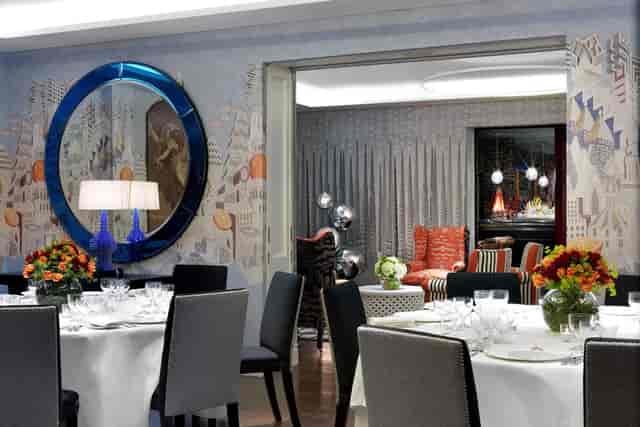 Intimate banquet setup in The Indigo Room with refined dining, perfect for corporate events.