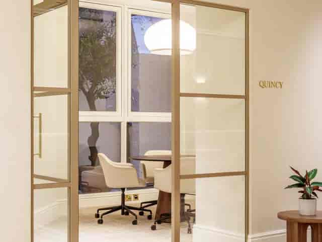 Huddle room for high-stakes client meetings with natural light for corporate events.