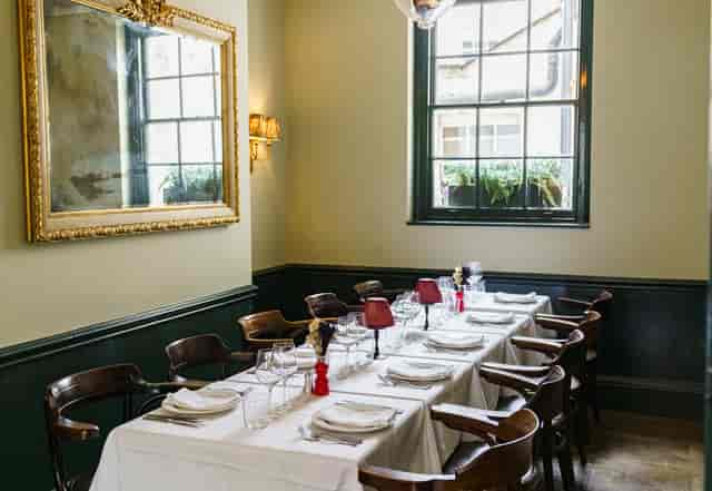 The Snug at The Barley Mow: intimate private dining setup for corporate luncheons and meetings.