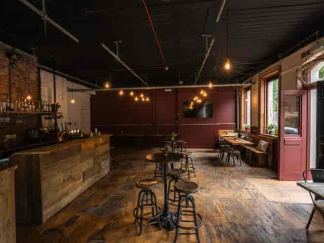 Industrial-chic Snug at The Barley Mow, ideal for networking mixers and team events.