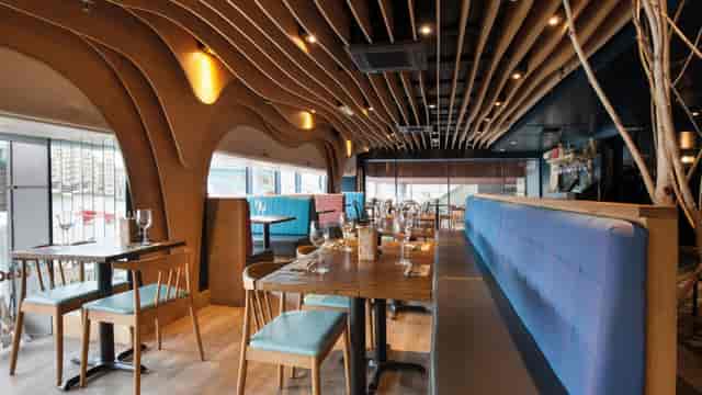Group dining area at Zizzi Bankside, featuring stylized decor for corporate events and celebrations.