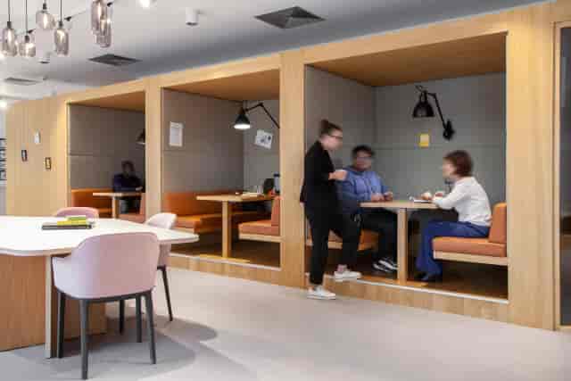 Agile meeting rooms with breakout pods for collaborative workspace and business events.