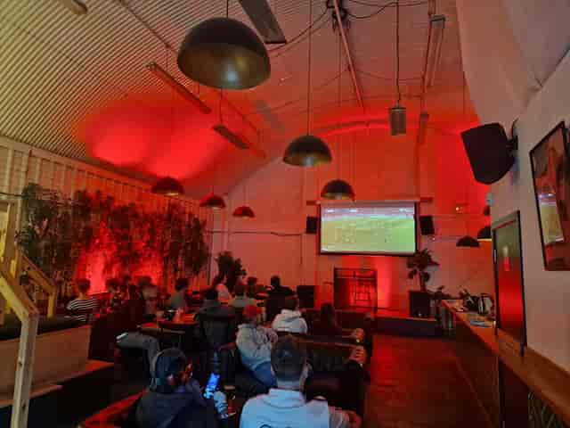 Red Arch main room with tiered seating for corporate events and private venue hire.