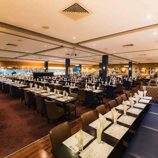 Banquet-style Main Room at Red Arch for corporate luncheons and gala events with structural columns.