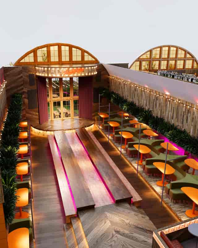 Red Arch Main Room: Versatile event space with stage for corporate celebrations and networking.