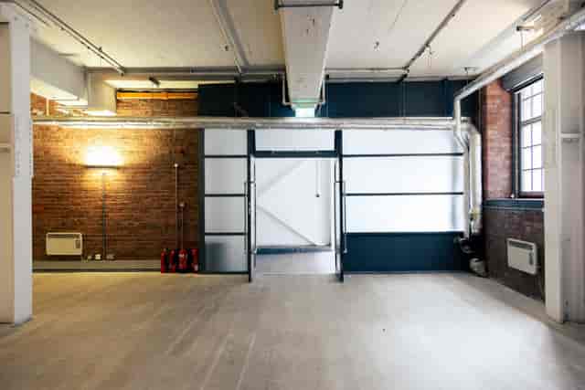 Industrial-chic production space at Qube Acton for pop-up galleries and creative workshops.