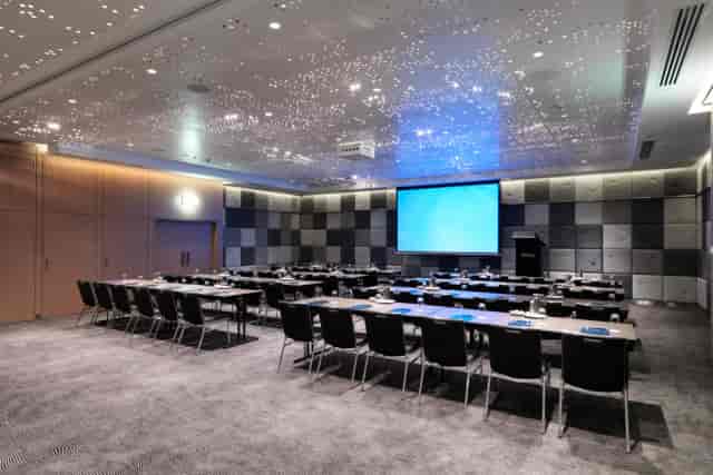 Classroom-style Grand Ballroom with starlit ceiling for corporate meetings and training events.