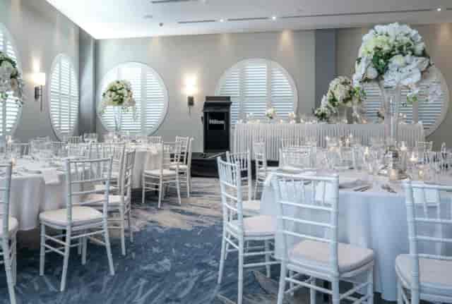 Luxury gala setup at Hilton Surfers Paradise with elegant floral centerpieces and table settings.