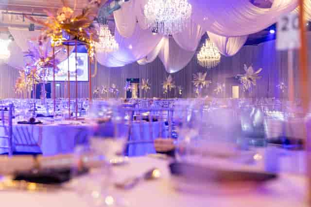Gala at Gold Coast Convention Centre: Elegant crystal chandeliers and floral decor for event venues.