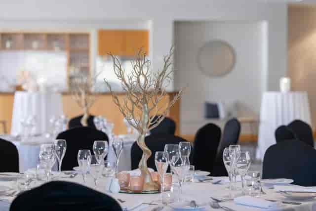 Modern banquet setup with manzanita centerpieces, Novotel Surfers Paradise wedding reception.