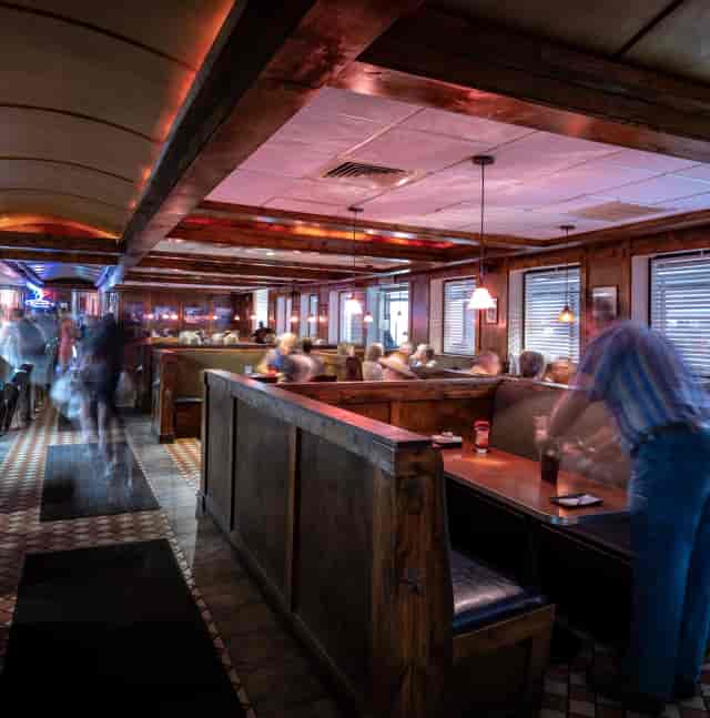 Private event space at McCarthy's Pub NYC featuring fixed booths for casual networking meetings.