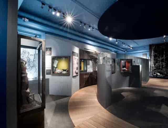 Lejongången event space with elegant lighting for corporate receptions and private gallery tours.