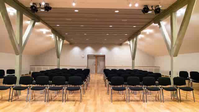 Horsalen conference room: rustic theater-style venue for corporate seminars and presentations.