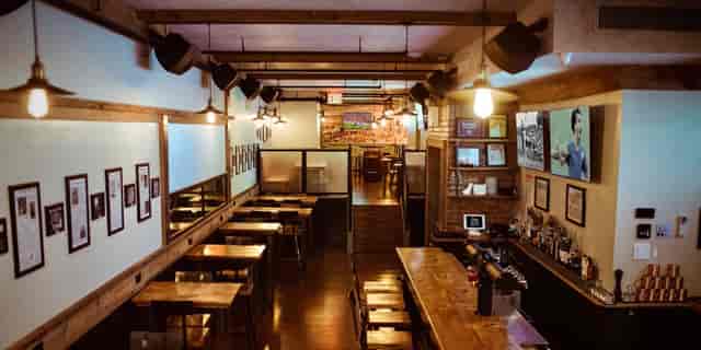Mezzanine at Long Acre Tavern: rustic venue for networking mixers and corporate events.